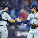 TORONTO, ON - OCTOBER 07: Andres Munoz #75 of the Seattle Mariners celebrates the win with catcher Cal Raleigh #29 following Game One of the AL Wild Card series against the Toronto Blue Jays at Rogers Centre on October 7, 2022 in Toronto, Ontario, Canada. (Photo by Vaughn Ridley/Getty Images)