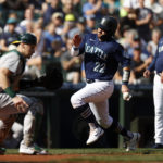 SEATTLE, WASHINGTON - OCTOBER 01: Luis Torrens #22 of the Seattle Mariners scores a run during the first inning against the Oakland Athletics at T-Mobile Park on October 01, 2022 in Seattle, Washington. (Photo by Steph Chambers/Getty Images)