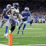 DETROIT, MICHIGAN - OCTOBER 02: Rashaad Penny #20 of the Seattle Seahawks scores a touchdown in the fourth quarter of the game against the Detroit Lions at Ford Field on October 02, 2022 in Detroit, Michigan. (Photo by Gregory Shamus/Getty Images)