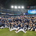 TORONTO, ONTARIO - OCTOBER 08: The Seattle Mariners celebrate after defeating the Toronto Blue Jays in game two to win the American League Wild Card Series at Rogers Centre on October 08, 2022 in Toronto, Ontario. The Seattle Mariners defeated the Toronto Blue Jays with a score of 10 to 9. (Photo by Mark Blinch/Getty Images)
