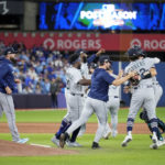 TORONTO, ONTARIO - OCTOBER 08: The Seattle Mariners celebrate after defeating the Toronto Blue Jays in game two to win the American League Wild Card Series at Rogers Centre on October 08, 2022 in Toronto, Ontario. The Seattle Mariners defeated the Toronto Blue Jays with a score of 10 to 9. (Photo by Mark Blinch/Getty Images)