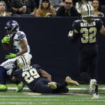 NEW ORLEANS, LOUISIANA - OCTOBER 09: Tyler Lockett #16 of the Seattle Seahawks catches a touchdown pass in the second quarter of the game against the New Orleans Saints at Caesars Superdome on October 09, 2022 in New Orleans, Louisiana. (Photo by Chris Graythen/Getty Images)