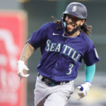 HOUSTON, TEXAS - OCTOBER 11: J.P. Crawford #3 of the Seattle Mariners celebrates his solo home run against the Houston Astros during the fourth inning in game one of the American League Division Series at Minute Maid Park on October 11, 2022 in Houston, Texas. (Photo by Carmen Mandato/Getty Images)