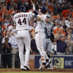 HOUSTON, TEXAS - OCTOBER 11: Alex Bregman #2 of the Houston Astros celebrates his two-run home run against the Seattle Mariners with Yordan Alvarez #44 during the eighth inning in game one of the American League Division Series at Minute Maid Park on October 11, 2022 in Houston, Texas. (Photo by Bob Levey/Getty Images)