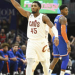 
              Cleveland Cavaliers guard Donovan Mitchell (45) celebrates after making a 3-point basket during the second half of an NBA basketball game against the New York Knicks, Sunday, Oct. 30, 2022, in Cleveland. (AP Photo/Nick Cammett)
            