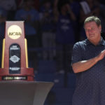 
              FILE - Kansas head coach Bill Self applauds last season's national championship team during Late Night in the Phog, the school's annual NCAA college basketball kickoff, at Allen Fieldhouse, Friday, Oct. 14, 2022, in Lawrence, Kan. Kansas and Baylor tied for No. 5 in the preseason AP Top 25 men's basketball poll released Monday, Oct. 17, 2022. (AP Photo/Charlie Riedel, File)
            
