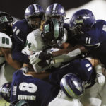 
              Hawaii wide receiver Chuuky Hines (84) gets wrapped up by the Nevada defense during the first half of an NCAA college football game on Saturday, Oct. 15, 2022, in Honolulu. (AP Photo/Marco Garcia)
            
