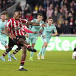 
              Brentford's Ivan Toney scores against Brighton and Hove Albion during the English Premier League soccer match at the Gtech Community Stadium, London, Friday Oct. 14, 2022. (John Walton/PA via AP)
            