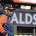 
              Houston Astros manager Dusty Baker Jr., watches players during the baseball team's workout Friday, Oct. 14, 2022, in Seattle for Saturday's Game 3 of an AL Division Series against the Seattle Mariners. (AP Photo/Stephen Brashear)
            