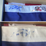 
              This image provided by Dan Vitale shows a U.S. flag signed by quarterback Tom Brady. Vitale, the owner of the flag, sued the New England Patriots on Wednesday, Oct. 5, 2022, saying the team caused irreparable damage to the flag by improperly displaying it at the team's hall of fame at Gillette Stadium. The suit contends that after the flag had been on display for a couple of months, Brady’s signature written in blue Sharpie had significantly faded, which reduced the flag’s value by as much as $1 million. (Dan Vitale via AP)
            