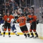 
              Anaheim Ducks right wing Troy Terry (19) celebrates with defenseman Kevin Shattenkirk (22) and other teammates after scoring during the second period of an NHL hockey game against the Tampa Bay Lightning in Anaheim, Calif., Wednesday, Oct. 26, 2022. (AP Photo/Ashley Landis)
            