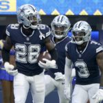 
              Dallas Cowboys' Malik Hooker (28), Kelvin Joseph, center rear, and Anthony Brown (3) celebrate after Hooker intercepted a Los Angeles Rams' Matthew Stafford pass in the second half of an NFL football game, Sunday, Oct. 9, 2022, in Inglewood, Calif. (AP Photo/Marcio Jose Sanchez)
            