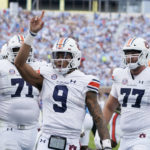 
              Auburn quarterback Robby Ashford (9) celebrates his first half touchdown run against Mississippi during their NCAA college football game in Oxford, Miss., Saturday, Oct. 15, 2022. (AP Photo/Rogelio V. Solis)
            
