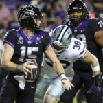 
              TCU quarterback Max Duggan (15) looks to pass as he is pursued by Kansas State defensive end Brendan Mott (38) during the first half of an NCAA college football game Saturday, Oct. 22, 2022, in Fort Worth, Texas. (AP Photo/Richard W. Rodriguez)
            