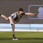 
              San Diego Padres' pitcher Josh Hader stretches in the outfield during baseball practice Monday, Oct. 10, 2022, in Los Angeles for the National League division series against the Los Angeles Dodgers. (AP Photo/Mark J. Terrill)
            