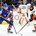 
              New York Islanders center Mathew Barzal (13) and Anaheim Ducks center Derek Grant (38) fight for the puck during the first period of an NHL hockey game, Saturday, Oct. 15, 2022, in Elmont, N.Y. (AP Photo/Julia Nikhinson)
            