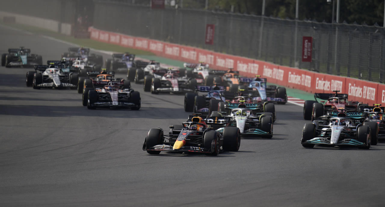 Red Bull driver Max Verstappen, of the Netherlands, leads the pack during the start of the Formula ...