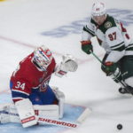 
              Minnesota Wild's Kirill Kaprizov moves in on Montreal Canadiens goaltender Jake Allen during the second period of an NHL hockey game, Tuesday, Oct. 25, 2022 in Montreal. (Graham Hughes/The Canadian Press via AP)
            