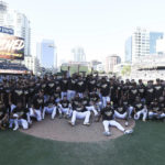 
              The San Diego Padres pose for a team photo following a baseball game against the Chicago White Sox after clinching a wild-card playoff spot Sunday, Oct. 2, 2022, in San Diego. (AP Photo/Derrick Tuskan)
            