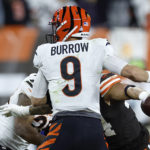 
              Cincinnati Bengals quarterback Joe Burrow (9) fumbles the ball while hit by Cleveland Browns linebacker Sione Takitaki, right, during the first half of an NFL football game in Cleveland, Monday, Oct. 31, 2022. (AP Photo/Ron Schwane)
            