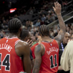 
              Chicago Bulls forward DeMar DeRozan (11) gestures to the crowd after scoring his 20,000th career point during the first half of an NBA basketball game against the San Antonio Spurs, Friday, Oct. 28, 2022, in San Antonio. (AP Photo/Nick Wagner)
            