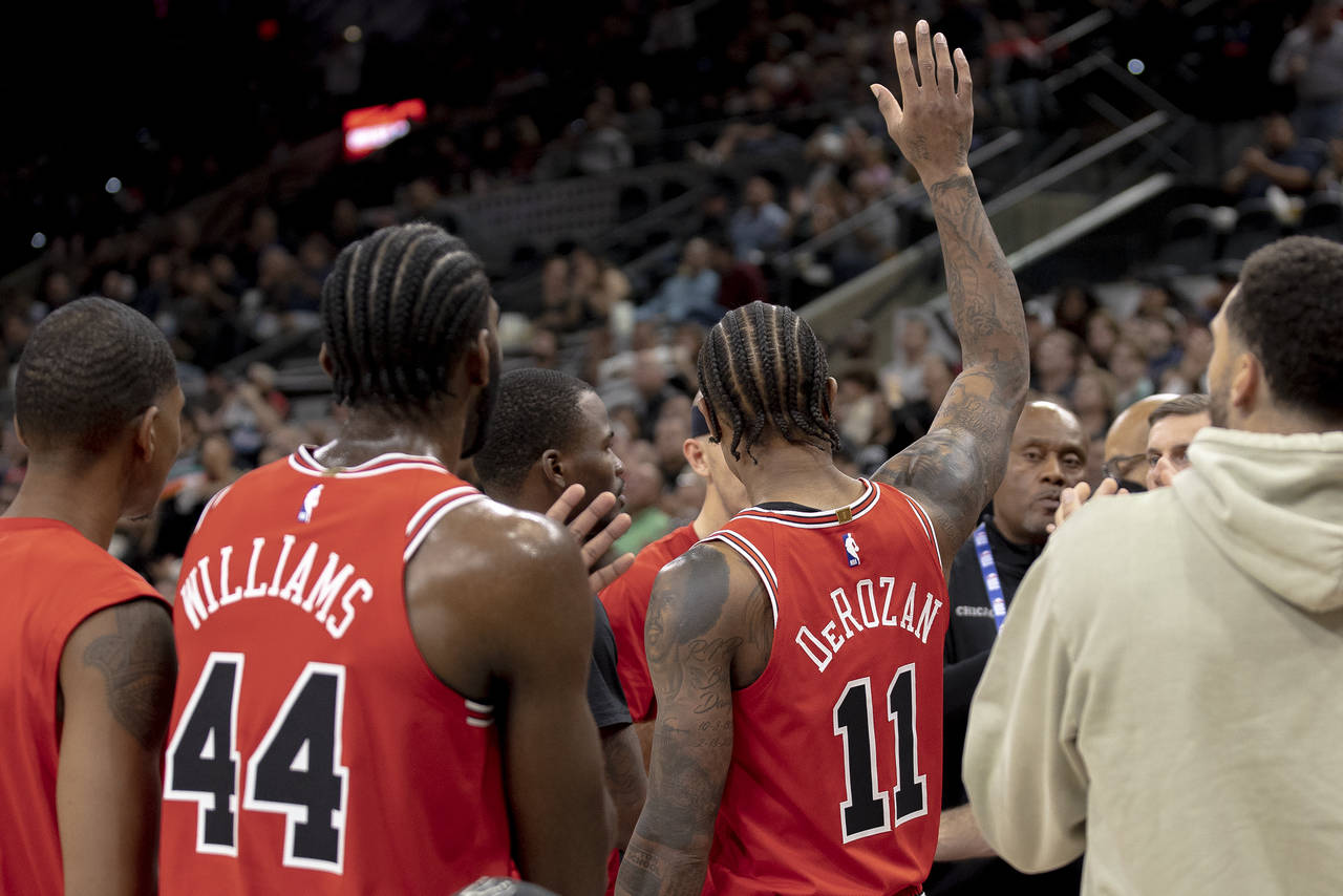 Chicago Bulls forward DeMar DeRozan (11) gestures to the crowd after scoring his 20,000th career po...