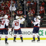 
              Washington Capitals right wing Garnet Hathaway (21) celebrates after scoring a goal in the second period of an NHL hockey game against the New Jersey Devils, Monday, Oct. 24, 2022, in Newark, N.J. (AP Photo/Adam Hunger)
            