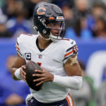 
              Chicago Bears quarterback Justin Fields (1) looks to pass against the New York Giants during the first quarter of an NFL football game, Sunday, Oct. 2, 2022, in East Rutherford, N.J. (AP Photo/John Minchillo)
            