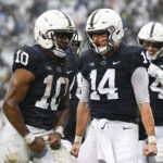 
              Penn State running back Nicholas Singleton (10) celebrates a touchdown with quarterback Sean Clifford (14) during the first half of an NCAA college football game against Northwestern, Saturday, Oct. 1, 2022, in State College, Pa. (AP Photo/Barry Reeger)
            