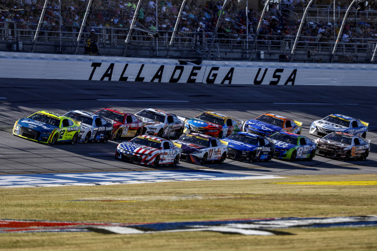 Ryan Blaney (12) leads the field through the tri-oval during a NASCAR Cup Series auto race Sunday, ...
