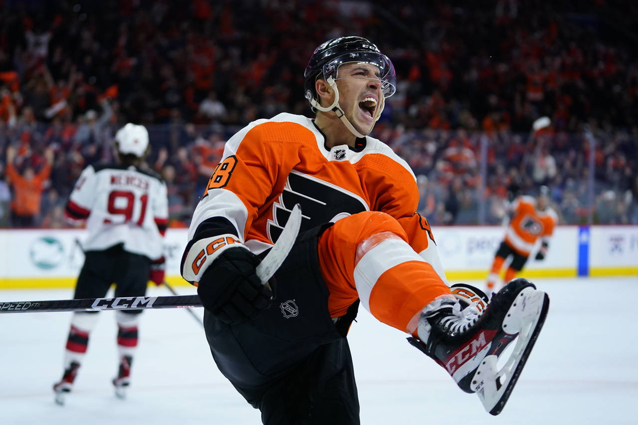 Philadelphia Flyers' Morgan Frost celebrates after scoring a goal during the second period of an NH...