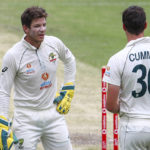 
              FILE - Australia's Tim Paine, left, talks with bowler Pat Cummins during play on day three of the fourth cricket test between India and Australia at the Gabba, Brisbane, Australia, on Jan. 17, 2021. Paine made a return to first-class cricket, Thursday, Oct. 6, 2022, for the first time in 18 months since he quit as test skipper after after a scandal involving explicit text messages he sent to a co-worker in 2017. (AP Photo/Tertius Pickard, File)
            
