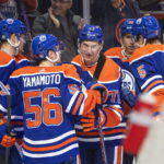 
              Edmonton Oilers' Ryan McLeod (71) celebrates with teammates after his goal against the Calgary Flames during the second period of an NHL hockey game Saturday, Oct. 15, 2022, in Edmonton, Alberta. (Jason Franson/The Canadian Press via AP)
            