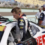 
              William Byron gets into his car during NASCAR Cup qualifying at Homestead-Miami Speedway, Saturday, Oct. 22, 2022, in Homestead, Fla. (AP Photo/Terry Renna)
            