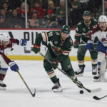 
              Minnesota Wild center Tyson Jost (10) handles the puck against Colorado Avalanche left wing Artturi Lehkonen (62) during the second period of an NHL hockey game Monday, Oct. 17, 2022, in St. Paul, Minn. (AP Photo/Stacy Bengs)
            