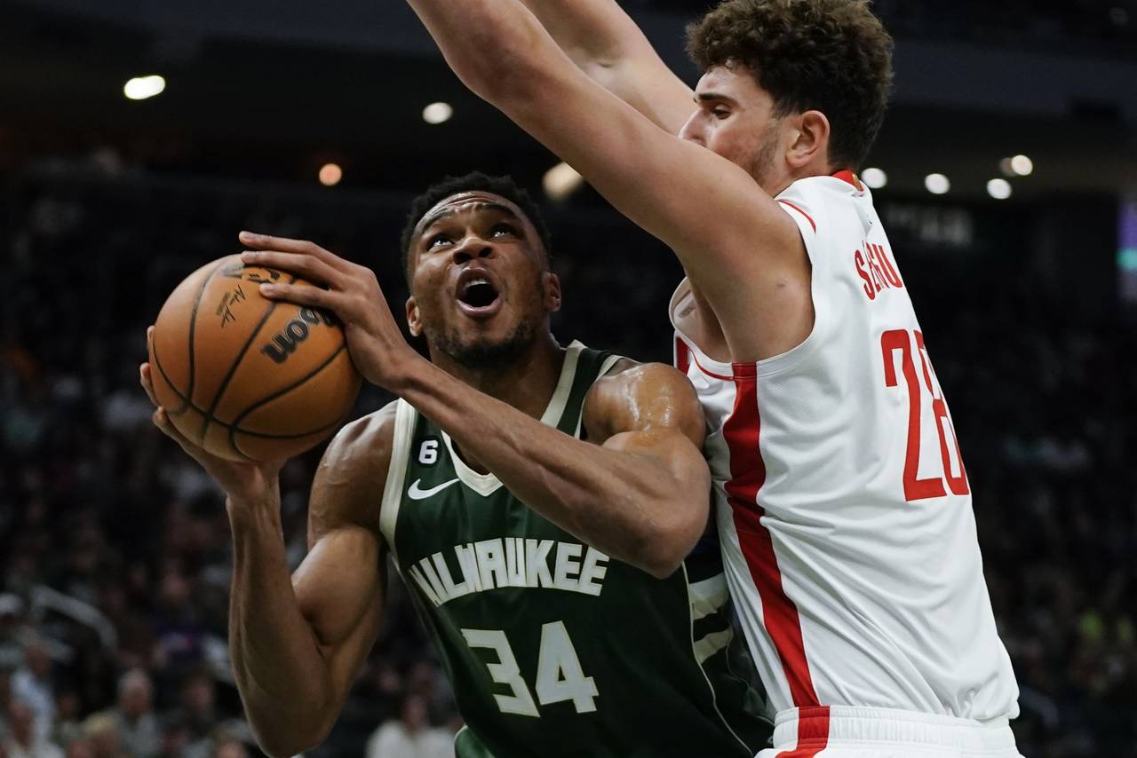Milwaukee Bucks' Giannis Antetokounmpo looks to shoots past Houston Rockets' Alperen Sengun during ...