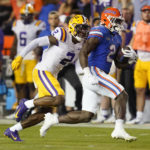 
              Florida running back Montrell Johnson Jr., right, outruns LSU cornerback Mekhi Garner for a 39-yard touchdown during the first half of an NCAA college football game, Saturday, Oct. 15, 2022, in Gainesville, Fla. (AP Photo/John Raoux)
            