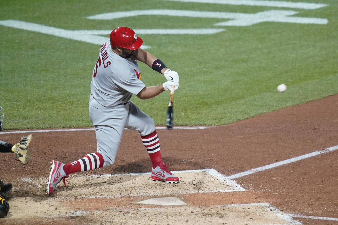 St. Louis Cardinals' Albert Pujols hits career home run No. 703 during the fifth inning of a baseba...