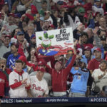 
              Fans cheer during the first inning in Game 3 of the baseball NL Championship Series between the San Diego Padres and the Philadelphia Phillies on Friday, Oct. 21, 2022, in Philadelphia. (AP Photo/Matt Slocum)
            