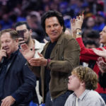 
              Detroit Pistons owner Tom Gores acknowledges the crowd during the second half of an NBA basketball game against the Orlando Magic, Wednesday, Oct. 19, 2022, in Detroit. (AP Photo/Carlos Osorio)
            