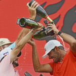 
              Eugenio Lopez-Chacarra, right, from Spain is sprayed in Champagne by teammates after winning the LIV Golf Invitational Bangkok 2022 at Stonehill Golf Club in Pathum Thani, Thailand, Sunday, Oct. 9, 2022. (AP Photo/Kittinun Rodsupan)
            