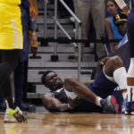 
              New Orleans Pelicans forward Zion Williamson lies on the ground after going down while driving to the basket in the second half of an NBA basketball game against the Utah Jazz in New Orleans, Sunday, Oct. 23, 2022. Williamson left the game and the Jazz won in overtime 122-121. (AP Photo/Gerald Herbert)
            