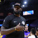 
              Los Angeles Lakers forward LeBron James stands on the court before a basketball game against the Golden State Warriors in San Francisco, Sunday, Oct. 9, 2022. (AP Photo/Godofredo A. Vásquez)
            
