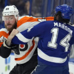 
              Tampa Bay Lightning left wing Pat Maroon (14) and Philadelphia Flyers left wing Nicolas Deslauriers (44) fight during the first period of an NHL hockey game Tuesday, Oct. 18, 2022, in Tampa, Fla. (AP Photo/Chris O'Meara)
            
