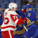 
              Detroit Red Wings left wing Adam Erne (73) and Buffalo Sabres left wing Victor Olofsson (71) battle after the whistle during the second period of an NHL hockey game, Monday, Oct. 31, 2022, in Buffalo, N.Y. (AP Photo/Jeffrey T. Barnes)
            