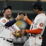 
              Houston Astros second baseman Jose Altuve, left, and Houston Astros shortstop Jeremy Pena (3) celebrate a win after Game 1 of baseball's American League Championship Series between the Houston Astros and the New York Yankees, Wednesday, Oct. 19, 2022, in Houston. The Houston Astros won 4-2. (AP Photo/Kevin M. Cox)
            