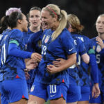 
              United States' Sophia Smith, left, celebrates with teammates after scoring her side's opening goal during the women's friendly soccer match between England and the US at Wembley stadium in London, Friday, Oct. 7, 2022. (AP Photo/Kirsty Wigglesworth)
            
