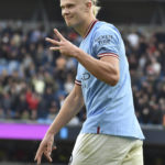 
              Manchester City's Erling Haaland celebrates after scoring his side's fifth goal and his personal hat trick during the English Premier League soccer match between Manchester City and Manchester United at Etihad stadium in Manchester, England, Sunday, Oct. 2, 2022. (AP Photo/Rui Vieira)
            