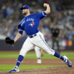 
              Toronto Blue Jays relief pitcher Tim Mayza works against the Seattle Mariners during the seventh inning of Game 1 in an AL wild-card baseball playoff series in Toronto on Friday, Oct. 7, 2022. (Frank Gunn/The Canadian Press via AP)
            