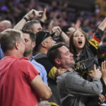 
              Vegas Golden Knights fans cheer the team's go-ahead goal during the third period of an NHL preseason hockey game against the Arizona Coyotes on Tuesday, Oct. 4, 2022, in Las Vegas. The Golden Knights won 4-3. (AP Photo/Sam Morris)
            